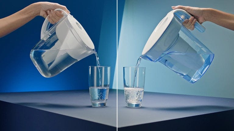 A Brita and ZeroWater pitcher pouring water into glasses