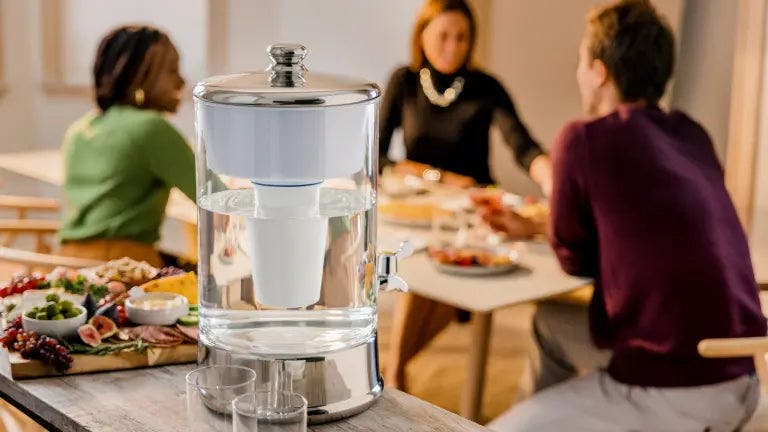 ZeroWater 40 cup glass dispenser in front of a dinner table